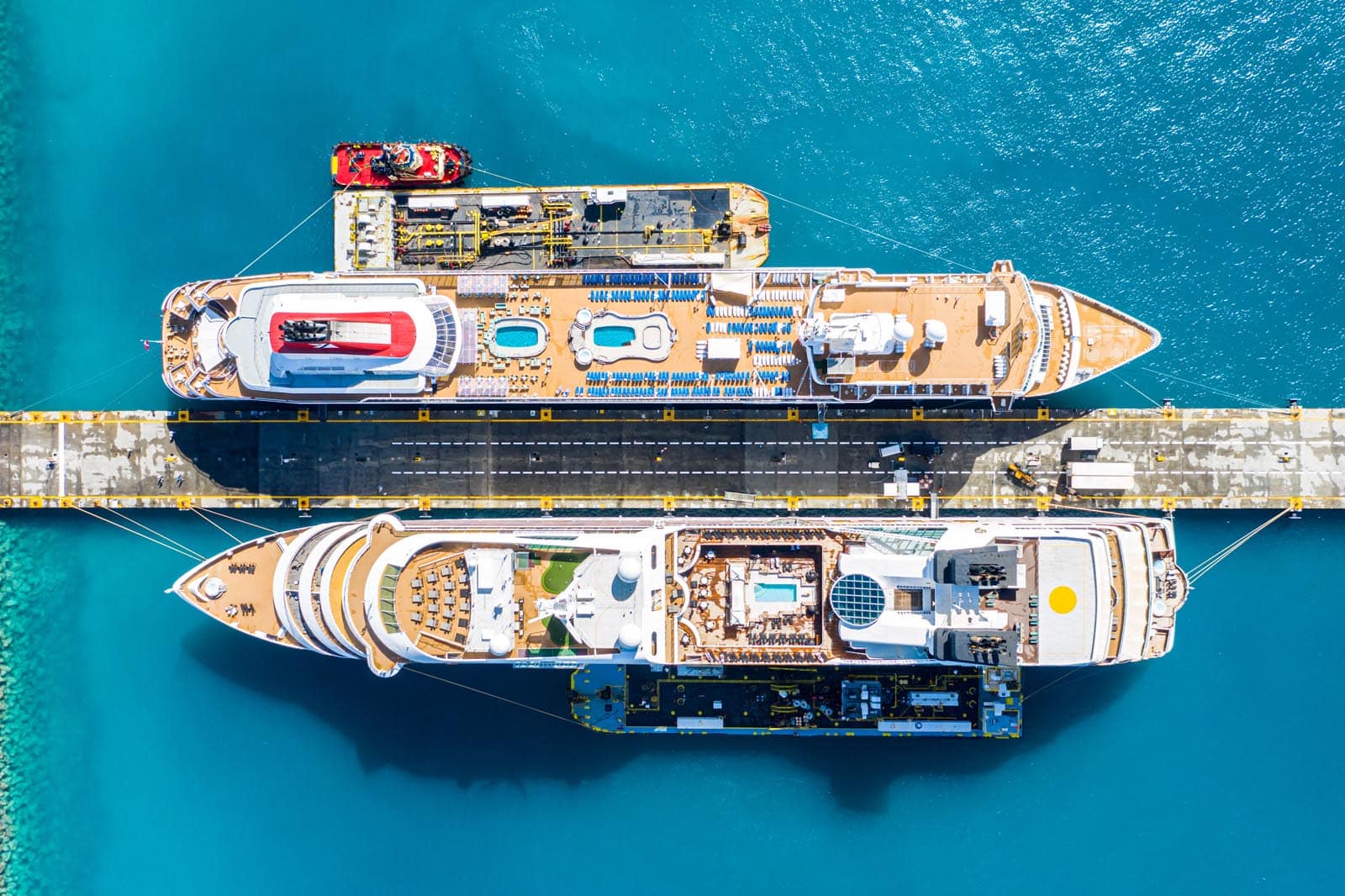 Aerial view of two giant cruise ships docked in Port Sint Maarten - Philipsburg