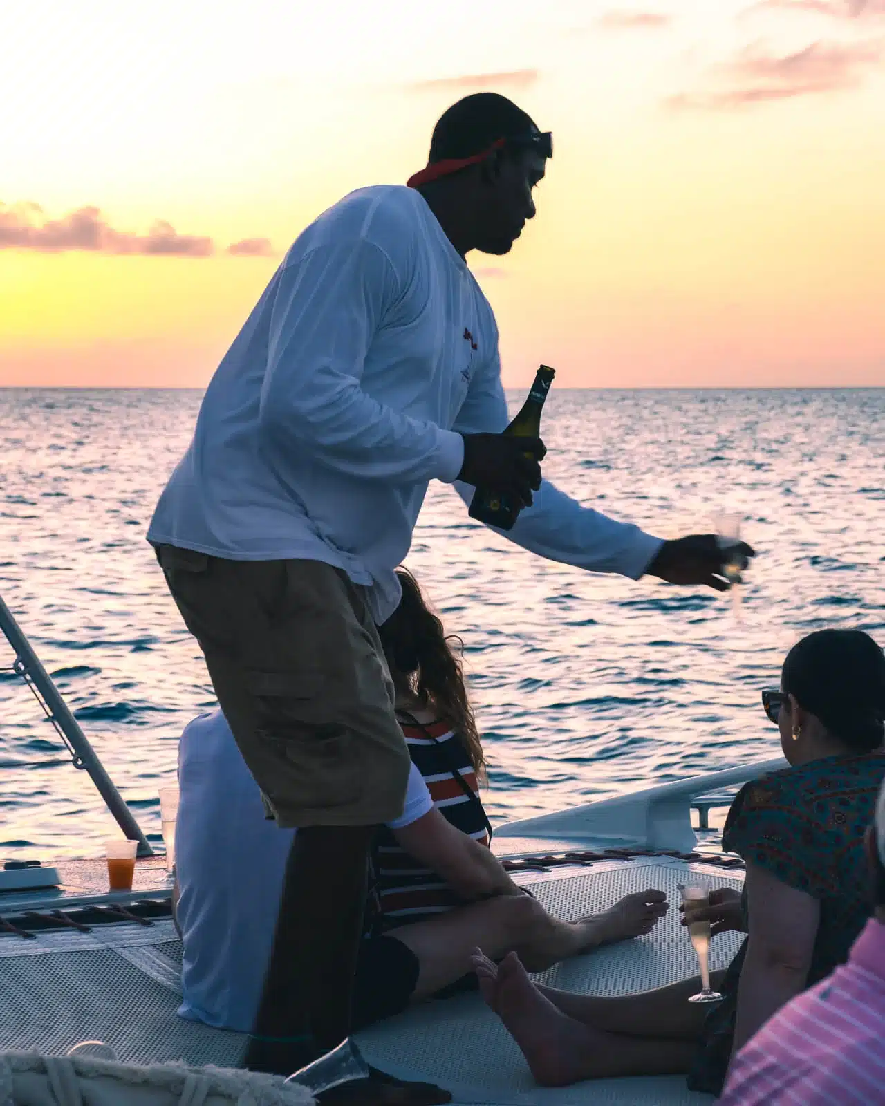 The great team handing out bubbles all over the boat! Sunset Cruise with Aqua Mania – We Are! SXM – Creating Caribbean Memories